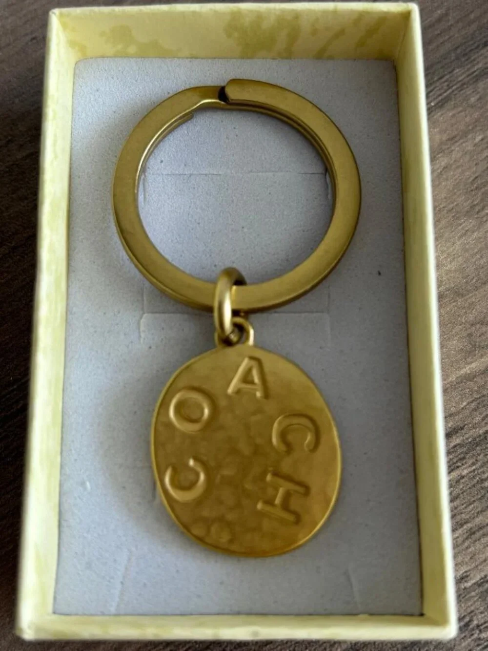 Coach Brass Circular Bag Charm Key Chain w/Coach Embossed in Block Letters